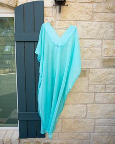 This teal kaftan is flowy, fun, and perfect for a daytime look. Dress it up with some sky-high heels, or make it more down to earth with strappy sandals. The side slits create a gorgeous flutter in the wind, and the bra saver will hold the kaftan in place as you twirl and dance. We can’t wait to see how you style her! All kaftans are handmade in small batches in Austin,TX. Sizes and color may slightly vary due to lighting and screen settings. Sky High, Austin Texas, Small Batches, Austin Tx, Strappy Sandals, Austin, Texas, Color