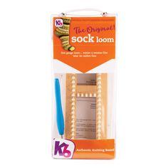 the original sock loom is packaged in a cardboard package with a blue toothbrush