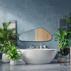 a bathroom with blue walls, plants and a large oval bathtub in the middle