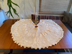 a table topped with an umbrella shaped doily