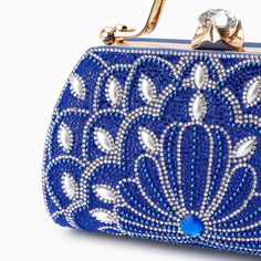 Introducing the Augustine Pearls Handbag - an enchanting masterpiece crafted to elevate your evening attire to unprecedented levels of sophistication. This clutch exudes magnificence in every detail, adorned with shimmering rhinestones and delicate pearl accents. Remarkably lightweight, it guarantees seamless carrying all through the night without compromising on style. Now available in blue, black, silver, and red. Glamorous Pearl-embellished Evening Bag For Events, Elegant Rhinestone Evening Bag For Events, Glamorous Handheld Evening Bag With Pearl Handle, Embellished Handheld Evening Bag, Handheld Embellished Evening Bag, Glamorous Pearl-embellished Evening Bag, Rhinestone Clutch Evening Bag, Glamorous Embellished Evening Bag, Formal Rhinestone Clutch Evening Bag