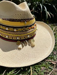 Hola and thank you for being part of our dream!  Here is very useful information before your purchase, but if you have any questions, do not hesitate to send us a message! Beautiful and colorful hats for women Handmade designed by Colombian artisan hands. It is exactly as shown in the pictures (It does include the decor on top) *SIZING* Size 3: 53-54cm Size 4: 55-56cm Size 5: 57-58cm Size 6: 59 +cm Please refer to the size measurement chart before ordering. You can find the measurement chart in the photos of our listing (all the way at the top). You will also find a guide that shows you how to take the correct measures. If you need additional photos or info to help you decide please message us! *GARMENT CARE* -Be sure to use only a damp cloth. A soaking wet cloth or sponge can cause water Multicolor Sun Hat For Kentucky Derby Vacation, Multicolor Sun Hat For Vacation And Kentucky Derby, Multicolor Sun Hat For Vacation At Kentucky Derby, Artisan Natural Hat Band For Beach, Artisan Wide Brim Panama Hat For Vacation, Artisan Wide Brim Panama Hat For Beach, Multicolor Summer Fedora For Vacation, Artisan Panama Hat With Curved Brim For Beach, Natural Artisan Sun Hat For The Beach