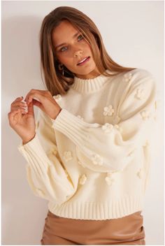 Daisy Sweater by Minkpink offers a mock neck and 3D knit flowers. The ribbed hem, cuff and neckline provide a classic finishing touch to the all-white sweater. Fabric: Mid-weight knit Shell: 52% acrylic/28% polyamide/20% polyester Hand wash Imported MG2304806 White High Neck Sweater For Spring, White Sweater With Ribbed Collar For Spring, White Ribbed Collar Sweater For Spring, White Spring Sweater With Ribbed Cuffs, White Ribbed Cuffs Sweater For Spring, Spring Soft Knit Turtleneck Sweater, White Sweater With Ribbed Cuffs For Spring, Soft Knit Turtleneck Sweater For Spring, Feminine White Crew Neck Sweater