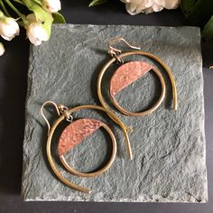 Hand formed brass & hammered copper. Finished with solid sterling silver earring wires.  Length ~ 2 inches Width ~ 1 3/4 inches Hammered Copper Drop Earrings, Artisan Hammered Metal Earrings, Hammered Copper Hoop Earrings As Gift, Hammered Copper Earrings For Gift, Hammered Copper Round Hoop Earrings, Copper Hammered Hoop Earrings As Gift, Hammered Rose Gold Copper Earrings, Hammered Rose Gold Copper Jewelry, Handmade Modern Copper Jewelry