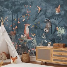 an animal themed wallpaper in a child's room with a teepee tent