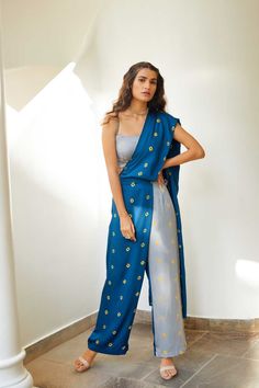 Got to rock that traditional look without actually wearing something traditional? Then ourBandhej saree pants is a perfect pick for you.Made in soft modal cotton satin.It features constranting colours to add that palyful element.Highlighted with elasticated back waist, side seam pockets.Closure- Side Seam ZipperStyling Tip- Pair it with dainty necklace and bracelet and you are ready to rock any occasion. Modal Satin Bandhej 1 Saree Pants 7-12 days No Customization Dry Clean Only Saree Pants, Pant Saree, Nykaa Fashion, Trendy Outfits Indian, Drape Pants, Dresses Indian, Designer Party Wear Dresses, Dress Indian Style, Trench Jacket