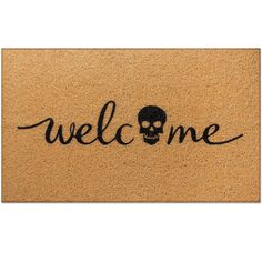 a welcome mat with a skull and the word welcome written on it in black ink