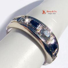 "Art Deco Band Ring Diamonds Synthetic Sapphire White Gold 18 K Gold. This handsome ring is a size 7 1/4, it is about 5/16\" wide and weighs 5 grams. 4 Sapphires and 3 diamonds 0.45 TCW. [nb348]" Art Deco Multi-stone Ring For Formal Occasions, Classic 14k White Gold Multi-stone Rings, Formal Multi-stone Diamond Ring With Round Band, Multi-stone Platinum Anniversary Rings, Anniversary Multi-stone Platinum Ring, Platinum Multi-stone Anniversary Ring, Heirloom White Gold Sapphire Ring With Multi-stone, Heirloom Style Multi-stone Sapphire Ring In White Gold, Classic Multi-stone Diamond Ring Collectible