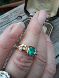 Beautiful 18k Yellow Gold, Approximately 1ct Cushion Cut Colombian Emerald, Diamond Baguette ring.. all sales are final. Weight is 5.5 Grams. Size 7 3/4.. Very Good Pre Owned Vintage Condition.. Ring Guard is NOT INCLUDED, just to show some ideas.. some pics ENLARGED to see details. Antique Box for Display only. Exquisite Emerald Ring With Baguette Cut Diamond, Exquisite Diamond Baguette Cut Emerald Ring, Timeless Baguette Cut Emerald Ring For Wedding, Timeless Baguette Cut Emerald Wedding Ring, Luxury Baguette Cut Emerald Wedding Ring, Luxury Wedding Emerald Ring With Baguette Cut, Luxury Wedding Baguette Cut Emerald Ring, Exquisite Emerald Ring With Baguette Cut Center Stone, Emerald Asscher Cut Ring With Baguette Diamonds For Wedding