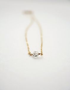 This necklace is perfect for the woman who likes a barely there wisp of jewelry. I've hand picked a gorgeous Herkimer Diamond that pairs well with either gold or silver. This piece makes a great gift for the holidays! + Herkimer Diamond. Chain. Spring Ring Clasp. + Length: Pick upon checkout. (length in photo is 16 inches) + Metal Material: Pick upon checkout. + Necklace takes 1-2 days to process. + Your jewelry will come in a jewelry box, tied with a ribbon. ➤➤ Have a question about this produc Minimalist Si Clarity Necklace For Anniversary, Gold Necklaces With Herkimer Diamond For Gift, Gold Herkimer Diamond Necklace As A Gift, Elegant Herkimer Diamond Jewelry For Gifts, Elegant Herkimer Diamond Jewelry For Anniversary, Minimalist Wedding Necklace With Ethical Gemstones, Simple Single Diamond Jewelry Gift, Minimalist Solitaire Necklace Gift, Modern Pearl Earrings