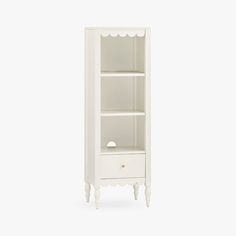 a white bookcase with an open drawer