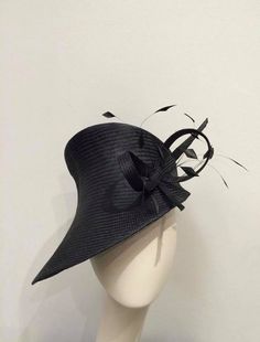 Stunning black parasisal headpiece, stiffened and hand blocked over millinery wooden hat block. All materials used to make the hats are of top quality and the hat blocks have been made to order by Boon & Lane in Luton, England. This type of parasisal straw is of the best quality and is used for the most sophisticated and luxurious hats. The hat is finished with a grosgrain petersham headsize band inside. HANDSEWN The original and stylish embellishment is composed by sophisticated feather trim en Luxury Black Hat With Rhinestones, Royal Ascot Hats, Couture Hats, Ascot Hats, Hat Blocks, Women Hats, Different Hats, Feather Trim, Unique Top