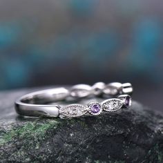 - Metal: Solid gold(10K/14K/18K white/yellow/rose gold),925 sterling silver,platinum available- Stone: natural purple amethysts and natural conflict free diamonds,SI-H Clarity and Color- Band Width: 1.4mm- Can be personalized: Yes Dainty Stackable Amethyst Ring For Anniversary, Elegant Purple Stackable Birthstone Ring, Purple Diamond Ring With Diamond Accents For Anniversary, Amethyst Diamond Ring With Rose Cut Diamonds For Anniversary, Purple Diamond Ring With Accents For Anniversary, White Gold Amethyst Ring With Diamond Accents For Wedding, White Gold Amethyst Wedding Ring With Diamond Accents, Elegant Stackable Amethyst Ring, Elegant Amethyst Stackable Promise Rings