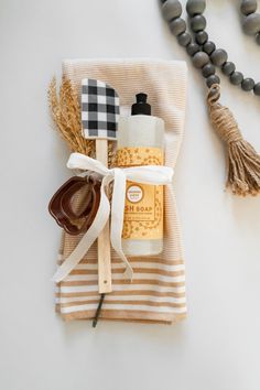 a pair of sunglasses sitting on top of a towel next to some soap and other items