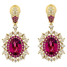 Sunita Nahata showcases an exquisite diamond studded Rubellite jewelry set that exudes grace and elegance. This exquisite 18Karat yellow gold set is ideal for any special occasion because it combines traditional elegance with modern flair. Rubellite Drop Earrings in 18Karat Yellow Gold with Ruby and White Diamond. Rubellite : 5.542 carat, 13.80X10.40mm Size, oval Shape. Rubellite : 5.420 carat, 13.90X10.20mm Size, oval Shape. Ruby : 1.138 carat, 1.70mm Size, round Shape. Ruby : 0.298 carat, 1.30mm Size, round Shape. White Diamond: 0.841 carat, 2.80mm Size, round Shape, G color, VS clarity. White Diamond: 2.394 carat, 4X2.5mm Size, pear Shape, G color, VS clarity. White Diamond: 0.267 carat, 1.50mm Size, round Shape, G color, VS clarity. White Diamond: 0.149 carat, 1.70mm Size, round Shape, Yellow Gold Ruby Earrings With Brilliant Cut, Elegant 22k Gold Gemstone Earrings, 22k Gold Gemstone Earrings For Formal Occasions, Luxury Hand Set Yellow Gold Earrings, Luxury 22k Gold Earrings For Formal Occasions, Formal Yellow Gold Earrings With Gemstone Accents, Exquisite Yellow Gold Earrings With Gemstone Accents, Yellow Gold Setting, Naha