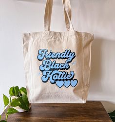 "Retro style Friendly Black Hottie tote bag! This tote is perfect for a day out on the town and for any shopping needs!  Tote Dimensions: -22 inch handles -14.25\" W x 15.5 \"H x 5\"X -100% Cotton -Natural Color" Y2k Design, Bag Y2k, Teacher Tshirts, Cool Items, Style Retro, Fashion Company, Retro Style, Best Sellers, Special Gifts