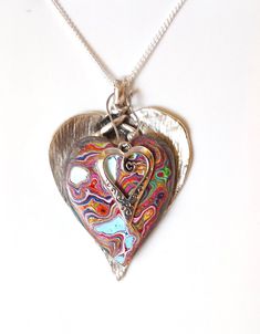 "Cadillaic Ranch Triple Fordite Detroit Agate Heart Necklace on Silver Pendant is 2.5\" long including the bail Comes in a nice Leatherette gift box" Multicolor Double Heart Jewelry For Valentine's Day, Multicolor Jewelry Valentine's Day Gift, Multicolor Jewelry For Valentine's Day Gift, Valentine's Day Multicolor Double Heart Jewelry, Valentine's Day Multicolor Jewelry Gift, Valentine's Day Gift Multicolor Jewelry, Multicolor Double Heart Jewelry Gift, Multicolor Double Heart Jewelry For Gift, Artistic Jewelry For Valentine's Day Gift