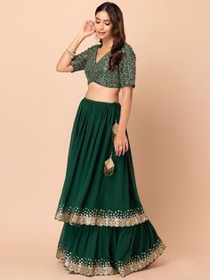 Introducing our amazing green sequins georgette reception wear lehenga choli, a stunning ensemble designed for those special occasions that deserve nothing but the best. This exquisite lehenga choli set will make you the center of attention at receptions, weddings, festivals, and parties, ensuring you look effortlessly stylish and elegant.
Crafted with precision and attention to detail, this green lehenga features a beautiful georgette material that drapes gracefully, enhancing your silhouette. Party Georgette Skirt Set With Zari Work, Party Skirt Set With Zari Work In Georgette, Festive Georgette Skirt Set For Party, Green Lehenga With Mirror Work For Party, Designer Georgette Party Wear Skirt Set, Designer Georgette Skirt Set For Party Wear, Green Choli With Mirror Work For Party, Green Designer Choli For Party Wear, Party Wear Georgette Skirt Set For Festive Occasions