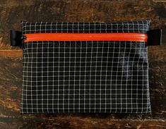 "Handmade in Vancouver This Listing is for the black  bag,   Ultralight super strong 210D Gridstop with Dyneema® perfect for camping ,hiking ,backpacking , ski, biking made from 2.92oz Dyneema (former Cuben Fiber) YKK water-resistant zipper zipper  bag 5X6.5 inch @~10g water-resistant  210D Grids-top material is made stronger and more abrasion resistant by a Dyneema UHMWPE fiber reinforcement grid on top of thebase ripstop pattern. The Dyneema grid also results in exceptional style=\"text-decora Functional Black Pouch For Outdoor Activities, Black Zipper Pouch For Outdoor, Black Outdoor Pouch With Zipper Closure, Functional Black Outdoor Pouch, Practical Black Pouch For Outdoor, Black Pouch With Zipper Pocket For Outdoor, Black Outdoor Pouch With Zipper Pocket, Ultralight Backpacking Gear, Ultralight Backpacking