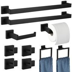 black bathroom accessories including toilet paper and towel holders