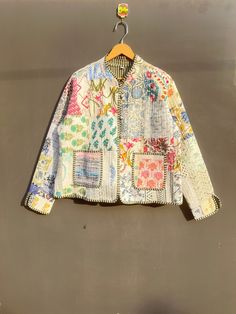 a colorful jacket hanging on a clothes line