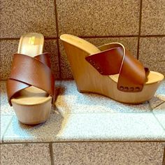 Brown Leather Sandals With Faux Wooden Wedge And Platform Toe. Never Worn, One Small Scuff On Toe (See Picture) True To Size Super Cute For Summer! Trendy Wedge Sandals With 4-inch Heel For Beach, Trendy Wedge Sandals With Wooden Heel, Trendy Beach Wedge Sandals With Wooden Heel, Beach Wedge Heels With Wooden Heel, Wedge Heels With Wooden Heel For Beach, Beach Heels With Wooden Wedge Heel, Casual Faux Leather Wedge Heels, Casual Faux Leather Wedge Sandals For The Beach, Beach Wedge Sandals With Wooden Heel