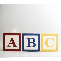 three blocks with letters that spell out the word abc