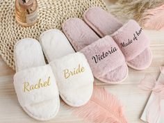 three personalized slippers on top of a table