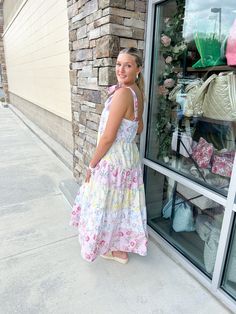 Introducing the Garden Picnic Floral Color-Block Dress! This beautiful dress features a stunning floral print and tiered ruffle design, perfect for any summer outing. The tie straps add a cute touch while keeping you comfortable. Feel confident and stylish in this must-have casual summer dress! Color-block Tired Tie Straps Ruffles Esme is wearing a size medium! Lilah is wearing a size small! Tiered Sundress With Tie Straps For Garden Party, Multicolor Sundress With Tie Straps For Brunch, Spring Sundress With Ruffled Straps For Picnic, Summer Sundress With Ruffled Straps For Picnic, Multicolor Ruffled Tiered Dress For Vacation, Multicolor Tiered Dress With Ruffles For Vacation, Tiered Multicolor Sundress For Vacation, Pink Summer Tiered Dress, Multicolor Tiered Vacation Dress