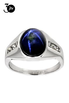 6.80ct 12x10mm oval blue star sapphire and .54ctw 2.5mm square white topaz rhodium over sterling silver men's ring.  Measures approximately 1/2"L x 1/16"W.  Finished under gallery. Not sizeable Blue Star Sapphire, Sterling Silver Mens Rings, Star Sapphire, Mens Silver Rings, Sterling Silver Mens, Men's Ring, Blue Star, Silver Man, White Topaz