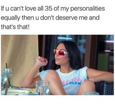 a woman sitting at a table with her hand up to her face and the caption that reads, if i can't love all 35 of my personalites equally then deserves