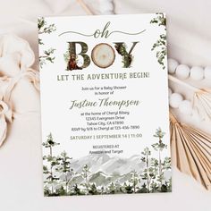 the baby shower is ready to be filled with greenery and mountains, including pine trees