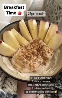 a bowl filled with oatmeal and sliced apples on top of each other