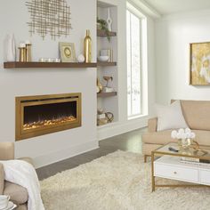 a living room filled with furniture and a fire place in the middle of the room