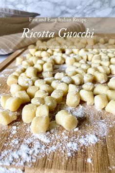 a wooden cutting board topped with pieces of food covered in powdered sugar on top of it