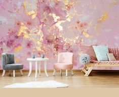 a living room with pink and gold paint on the wall, two chairs and a table