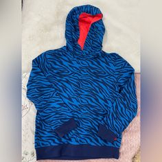 Cool And Comfortable Hoodie For Teens Playful Crew Neck Hoodie For Winter, Playful Blue Winter Sweatshirt, Playful Blue Hoodie With Long Sleeves, Playful Blue Long Sleeve Hoodie, Blue Long Sleeve Playful Hoodie, Blue Hoodie For Winter, Blue Hoodie Tops For Winter, Blue Hooded Top For Winter, Blue Hooded Winter Top