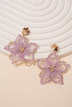 Make a statement with these beautiful Rhinestone Fabric Flower Earrings. These earrings are handmade with fabric flowers, embellished with shimmering rhinestones, creating a stunning and eye-catching look. Perfect for any special occasion or to add a touch of glamour to your everyday look. Shop now and add these unique earrings to your jewelry collection today! Size Length: 2.5 in (6.35 cm)Width: 2 in (5.08 cm) QualityEarrings are layered with two different flowers. Bottom flower with rhinestone Elegant Purple Flower Earrings For Party, Spring Party Beaded Earrings With Flower Shape, Spring Flower-shaped Beaded Earrings For Party, Spring Party Flower-shaped Beaded Earrings, Purple Flower Earrings For Party, Spring Party Flower Earrings With 3d Flowers, Spring Party 3d Flower Earrings, Purple Flower Earrings For Spring Party, Elegant Beaded Earrings For Spring Party