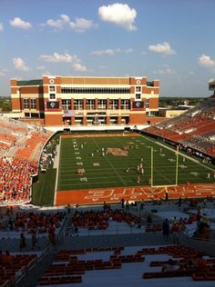 an empty football stadium filled with people