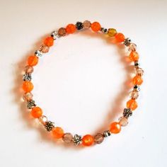 Handmade Orange & Brown Faceted Acrylic Beaded Stretch Bracelet With Small Flower Spacers. Bracelet Would Accent Any Outfit This Bracelet Was Designed By Me. It's One Of A Kind. Size 8 Nwot Adjustable Orange Faceted Beaded Bracelet, Adjustable Orange Stretch Bracelet, Casual Orange Beaded Bracelets, Casual Orange Beaded Bracelet, Adjustable Orange Stretch Bracelet With Round Beads, Casual Orange Beaded Stretch Bracelet, Orange Beaded Stretch Bracelet With Round Beads, Casual Orange Beaded Bracelets With Round Beads, Casual Orange Hand-strung Beaded Bracelets