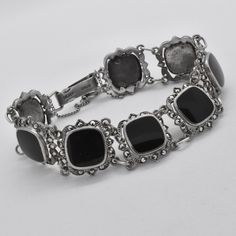 A lovely and stylish 70-ties vintage black onyx and marcasite stone set panel bracelet with safety chain in 925 sterling silver. In beautiful and clean vintage condition. There are a few small scratches on one of the stones. Please see images. Marked: Silver Oblo Size: Inner circumference 180 mm x 18.4 mm wide Weight: 24.48 grams Please have a look at our other items too. There are many more lovely jewellery pieces in our shop. https://www.etsy.com/uk/shop/DeVaultz DeVaultz Quality Vintage Jewel Sterling Silver Marcasite, Safety Chain, Black Gift Boxes, Vintage Jewels, Lovely Jewellery, Vintage Jewellery, Outfit Idea, Stone Settings, Chain Link Bracelet