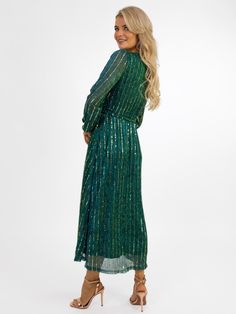 This gorgeous midi dress from Kate&Pippa features: Sparkle Detailing Faux wrap top Zip Up Back Midi Length Skirt Tie Wrap Belt Lined Gold Detail Pippa Dress, Kate And Pippa, Faux Wrap Top, Evening Dresses Online, Wrap Belt, Tie Wrap, Sparkle Dress, Midi Length Skirts, Wrap Top