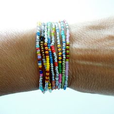 "A set of Two Single Strands stretch bracelets Silver based with multi colored patterns mixed in delicate 11\" seed beads strung on quality stretch cord Mostly Matte Opaque 11\" Japanese Toho seed beads with varying patterns Sold in 3 sizes: 6.0 (X/S) 6.5\" (s/m) and 7\" (m/l) I advise to get the bracelets 1/2\" bigger than actual wrist to ensure they stretch over hand and have a bit of slack when worn. If you need a size up please look at the Men's bracelets which start at 7.5\" and up. Stateme Everyday Multicolor Stretch Bracelet With Spacer Beads, Everyday Multicolor Tiny Beads Bracelet, Multicolor Tiny Beads Necklace For Friendship, Everyday Multicolor Tiny Beads Bracelets, Multicolor Tiny Beads Stretch Bracelet For Friendship, Multicolor Stretch Bracelet With Tiny Beads As Gift, Multicolor Tiny Beads Stretch Bracelet As Gift, Multicolor Stretch Bracelet With Tiny Round Beads, Adjustable Multicolor Dainty Stretch Bracelet