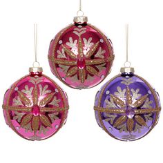 three christmas ornaments hanging from strings on a white background, each decorated with gold and purple designs