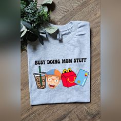 Super Cute Tee. On Gildan Adult Unisex Heatherd Ash Tee Shirt. Made With Sublimation. Ships Within 3 Business Days. Mom Stuff, Mom Life, Tee Shirt, Ash, Tee Shirts, Super Cute, Womens Tops, Tops & Tees, Ships