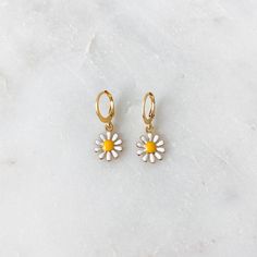 Dainty mini hoop earrings featuring a white daisy charm ❀❀ INFO: ❀❀ ➳ Hoop size: 12.5 mm x 14.5 mm ➳ Daisy charm size: 11 mm ➳ Hoops are gold plated stainless steel ➳ Daisy charm is gold plated brass ❀❀ PURPLE & GREEN DAISY EARRINGS: ❀❀ https://www.etsy.com/listing/1063301184/mini-daisy-hoop-earrings-in-lilac-purple?ref=shop_home_active_1 ❀❀ VIEW MORE EARRINGS: ❀❀ https://www.etsy.com/shop/bitsnpiecess/?section_id=23539584 ❀❀ SHIPPING & PROCESSING: ❀❀ Please refer to my shop announcement Spring Hoop Earrings With Flower Charm As Gift, Spring Flower Charm Hoop Earrings As Gift, Spring Gift Hoop Earrings With Flower Charm, Everyday Flower Charm Hoop Earrings, Small Hoop Jewelry For Spring Gift, Spring Gift Jewelry: Small Hoop, Trendy Hoop Earrings With Flower Charm For Spring, Adjustable Flower Hoop Earrings For Everyday, Trendy White Huggie Earrings For Everyday