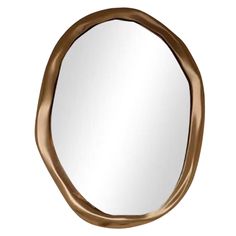 an oval mirror with a gold frame