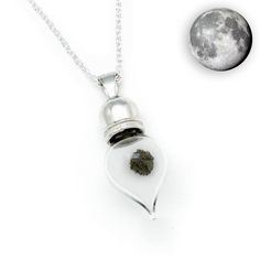 ***Unlike other vials of this type, ours is made from 100% Sterling Silver, not cheap metal******FREE worldwide shipping!***Contains genuine moon dust, yes, actual certified dust from the Moon!Real Moon Dust Necklace (NWA 4881)About Your Meteorite Pendant: - Approx. weight of moon dust is 20mg - Attached to a beautiful 20-inch Sterling Silver Chain - Made using a Solid Sterling Silver Cap - Pendant measures approx. 2.8cm x 1.2cm (1.1" x 0.47") - Comes presented in a lovely gift box - Comes with Moon Real, Lunar Meteorite, Meteorite Necklace, Space Necklace, Meteorite Jewelry, Meteorite Pendant, Moon Dust, Silver Caps, Moonstone Crystal