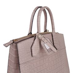 Guaranteed authentic limited edition special order Louis Vuitton City Steamer MM featured in Taupe Matte exotic leather.Inspired by Louis Vuitton luggage designed in1901 for Cruise ship travel, Nicolas Ghesquiere created the City Steamer handbag.Exquisite and effortlessly sleek, this beautiful neutral bag is carried by hand or over the shoulder.A perfect day bag it easily moves to business with ample room and a removable shoulder strap.An heirloom quality edition features a name tag, a hot stamp Luxury Crocodile Pattern Top Handle Satchel, High-end Travel Bags With Crocodile Pattern, High-end Crocodile Pattern Travel Bags, Luxury Rectangular Satchel With Crocodile Pattern, Luxury Leather Bag With Crocodile Pattern, Luxury Satchel With Crocodile Pattern Tote, Luxury Crocodile Pattern Tote Satchel, Luxury Business Bags With Crocodile Pattern, Classic Travel Satchel With Crocodile Pattern