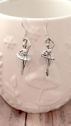 Pretty ballerina earrings! The silver plated fishhook ear wires measure 3/4" x 7/10", and the pewter ballerina charms measure 1 1/10" x 1/2 (Total length is approximately 1 4/5") All items are lead and nickel free, message with any questions, thanks! Ballet Earrings, Ballerina Earrings, Ballet Jewelry, Dance Earrings, Ballerina Jewelry, Ballerina Gift, Pretty Ballerinas, Tyler Tx, Ear Wires